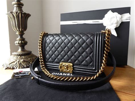 black chanel boy bag gold hardware|chanel black boyfriend bag.